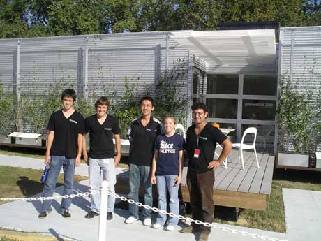 The Rice University team stands in front of its home at the 2009 Solar Decathlon