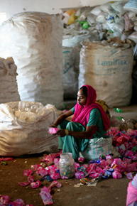 Photo: Waste-recycler in Bhopura, India . Courtesy of mackenzienicole via flickr