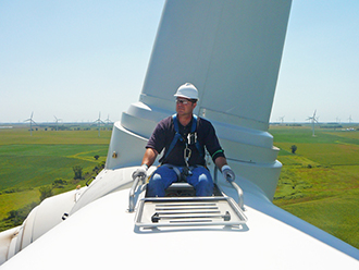 Rep. Bruce Braley (IA) sitting on a wind turbine in Iowa